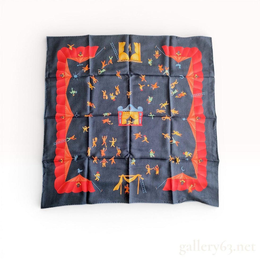 Bulgari Girotondo di Marionette Blue Silk Scarf w/Box: A square silk scarf manufactured by Bulgari, featuring the whimsical Girotondo di Marionette Blue pattern. The design centers on a dark navy blue field populated with numerous stylized marionette figu