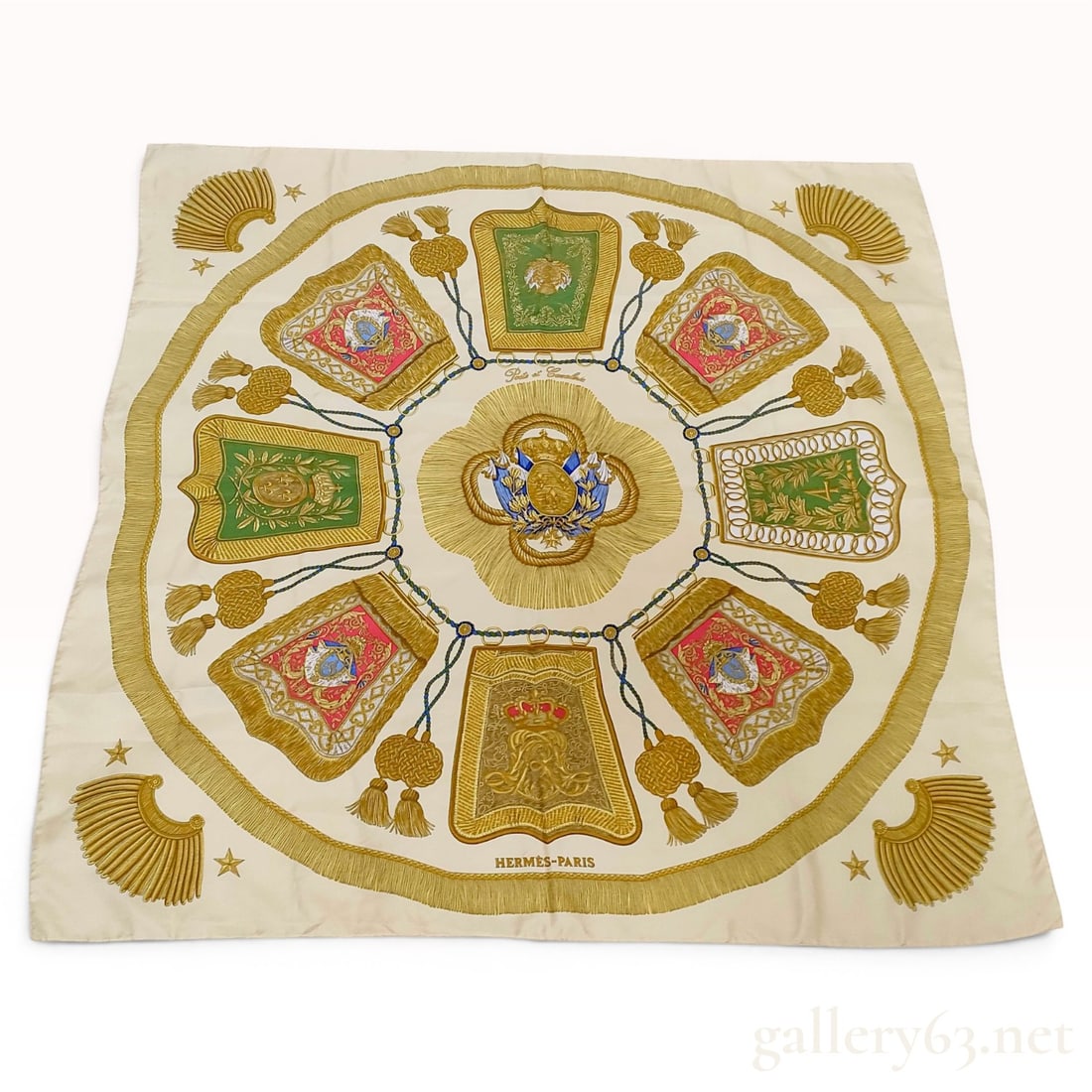 Hermes Silk Scarf in Poste et Cavalerie Pattern: This Hermes silk twill scarf features the Poste et Cavalerie pattern. The central motif is a royal coat of arms set within a sunburst of golden fringe on a cream ground. Eight radiating panels, each c