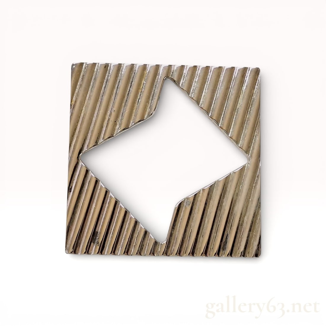 Tiffany and Co. Sterling Silver Geometric Reeded Brooch: Tiffany and Co. sterling silver modernist brooch featuring a square silhouette with a central diamond-shaped aperture. The front face is decorated with a diagonal reeded texture, while the reverse is 