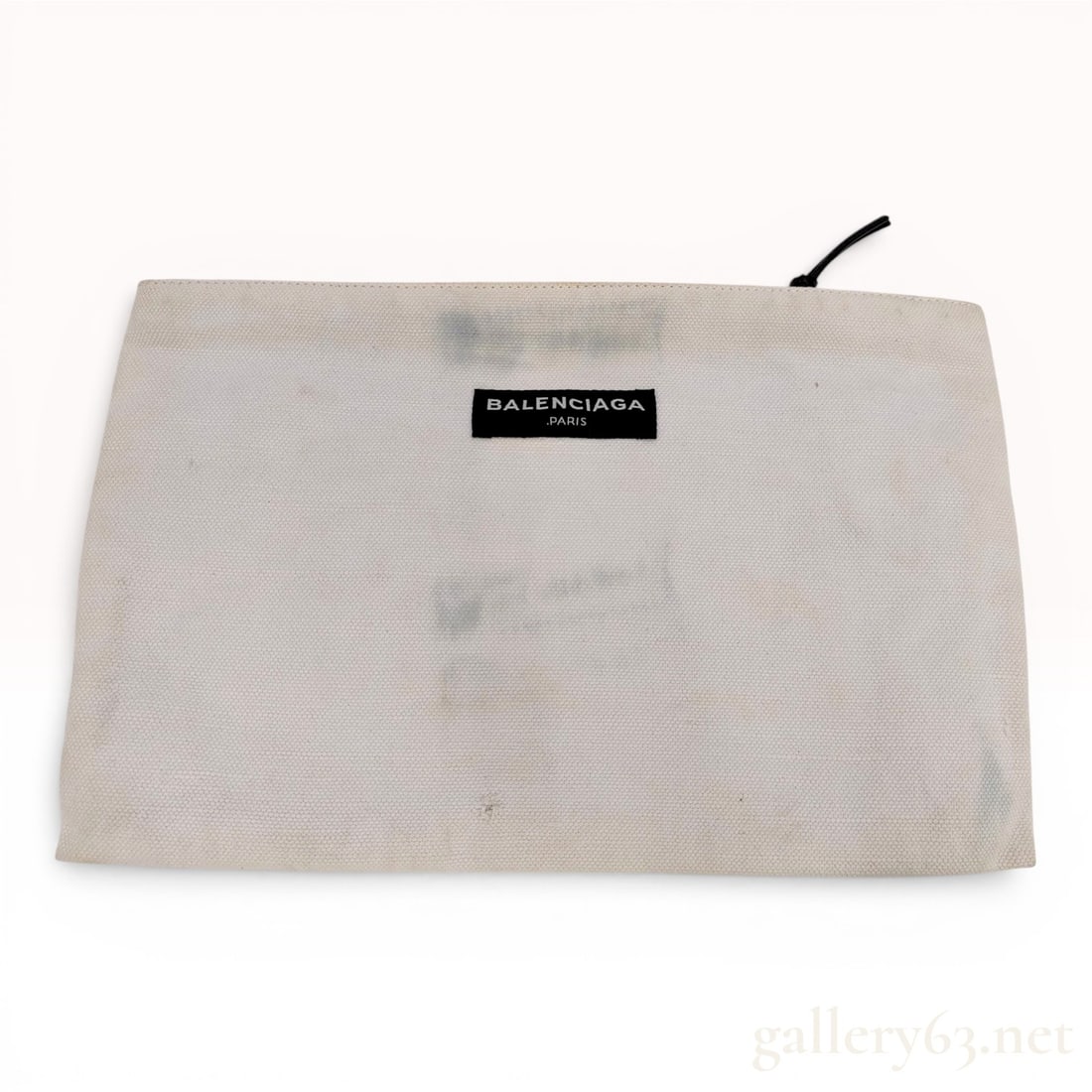 Balenciaga Canvas Navy Zip Pouch Clutch: This Balenciaga canvas pouch is a versatile accessory typically associated with the brand's Navy Cabas line. The exterior is crafted from off-white cream canvas and features a black rectangular patch 