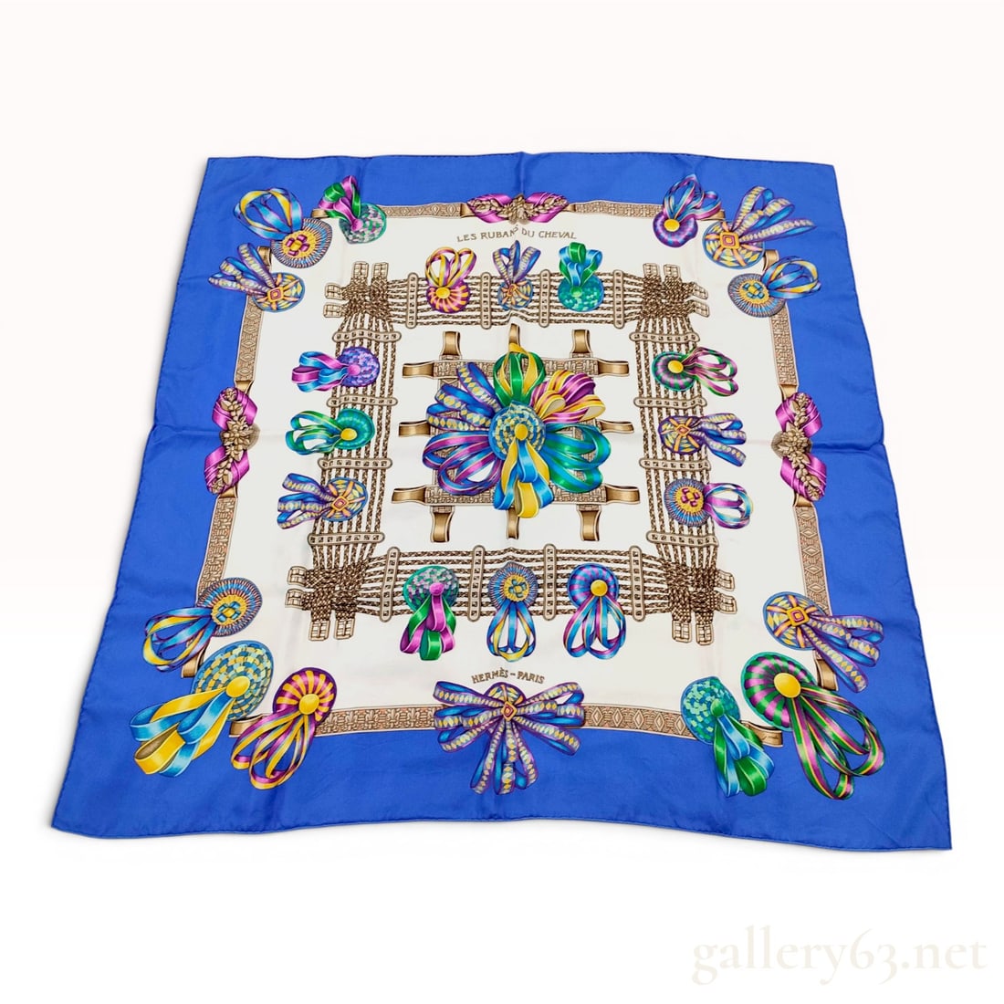 Hermes Les Rubans du Cheval Silk Scarf: An Hermes 100% silk twill scarf in the Les Rubans du Cheval pattern, designed by artist Joachim Metz. The equestrian-themed design features a complex arrangement of colorful prize ribbons, rosettes, a