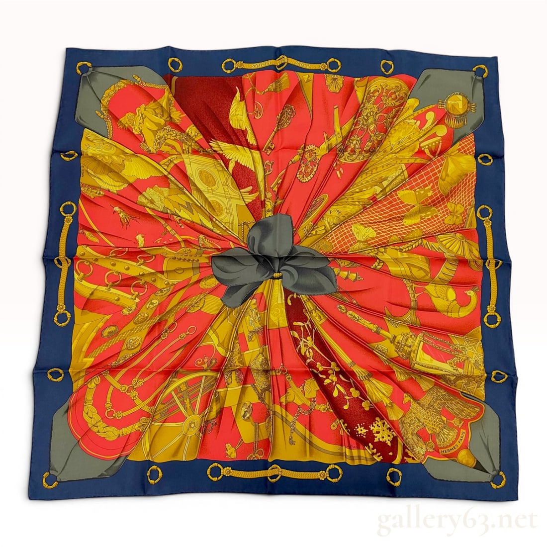 Hermes Caty Latham Soleil de Soie Silk Carre Scarf: Hermes Paris silk carre scarf in the Soleil de Soie (Silk Sun) pattern, designed by Caty Latham and first issued in 1995. The composition features a central trompe lâ€™oeil black gathered bow 