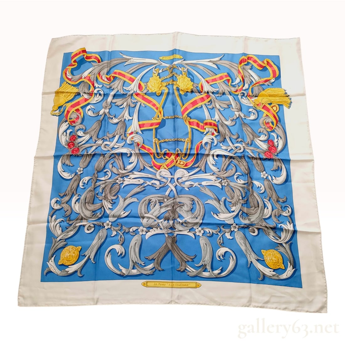 Hermes Le Mors a la Conetable Silk Carre 90 Scarf: An Hermes 100 percent silk scarf in the Le Mors a la Conetable pattern, originally designed by Henri d Origny. The design features a central motif of ornate gold-tone equestrian bits (mors) intertwine