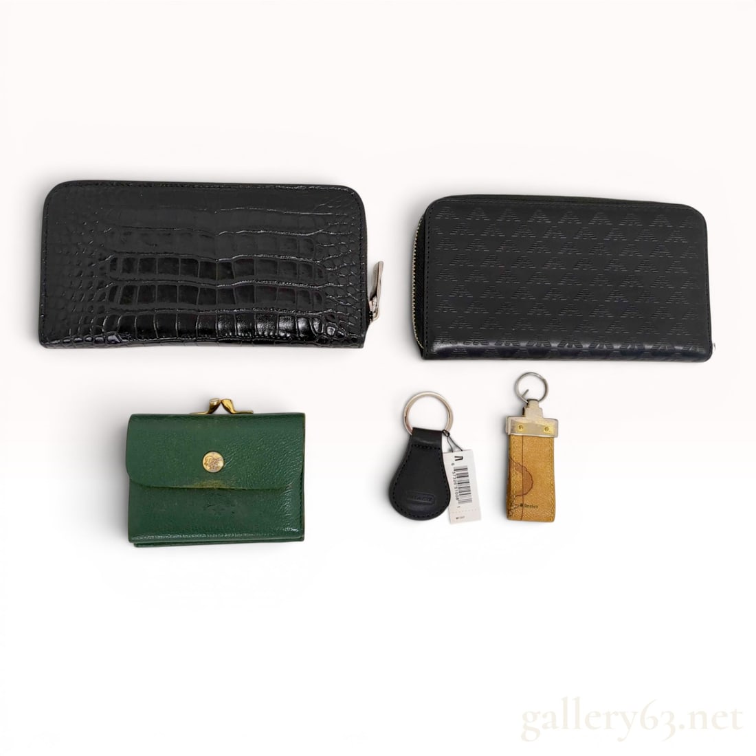 An Assortment of Designer Leather Wallets and Keychains Including Orobianco, Emporio Armani, and Il (1 of 10)