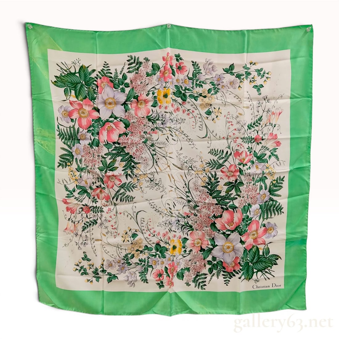 Christian Dior Vintage Floral Silk Scarf with Green Border: Vintage square silk scarf by Christian Dior featuring a lush botanical design of wildflowers and ferns on an ivory field. The central motif is framed by a wide green border and finished with hand-roll