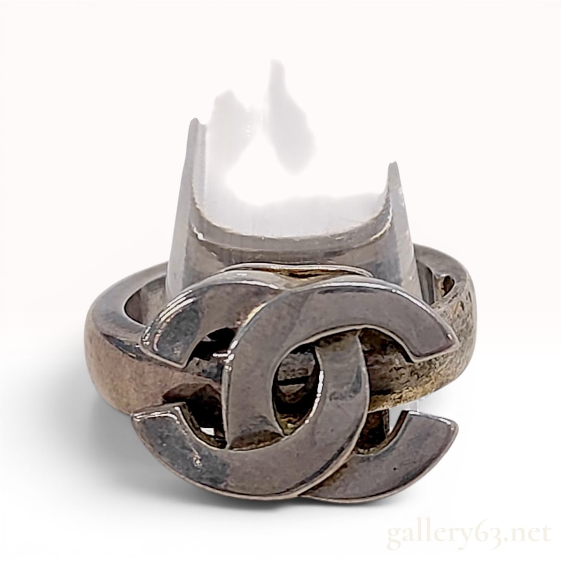 Chanel Spring 2001 CC Logo Silver-Tone Fashion Ring: This vintage Chanel fashion ring is from the Spring 2001 collection. The piece is constructed from silver-tone metal and features a wide band supporting a prominent, raised interlocking CC logo as the