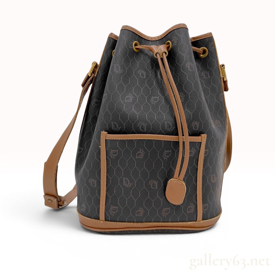 Christian Dior Honeycomb Monogram Coated Canvas Bucket Bag: Vintage Christian Dior bucket-style shoulder bag featuring the signature honeycomb monogram pattern, produced for the American market. The exterior is constructed from dark grey or black coated canvas