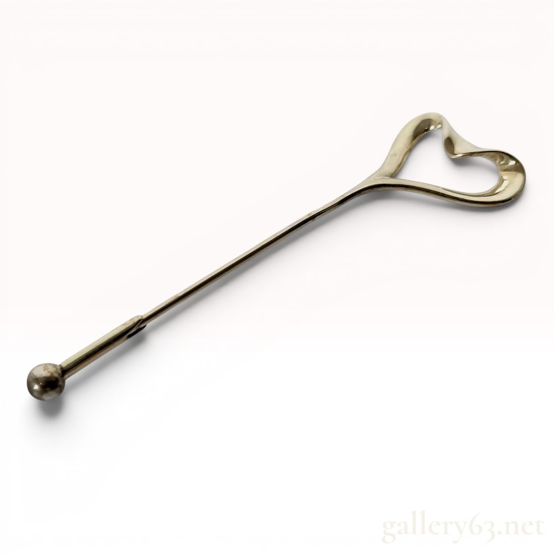 Tiffany and Co Elsa Peretti Sterling Silver Open Heart Stick Pin with Box: This sterling silver stick pin is designed by Elsa Peretti for Tiffany and Co, featuring the iconic Open Heart motif as the terminal. The piece consists of a long, slender pin topped with a fluid, org