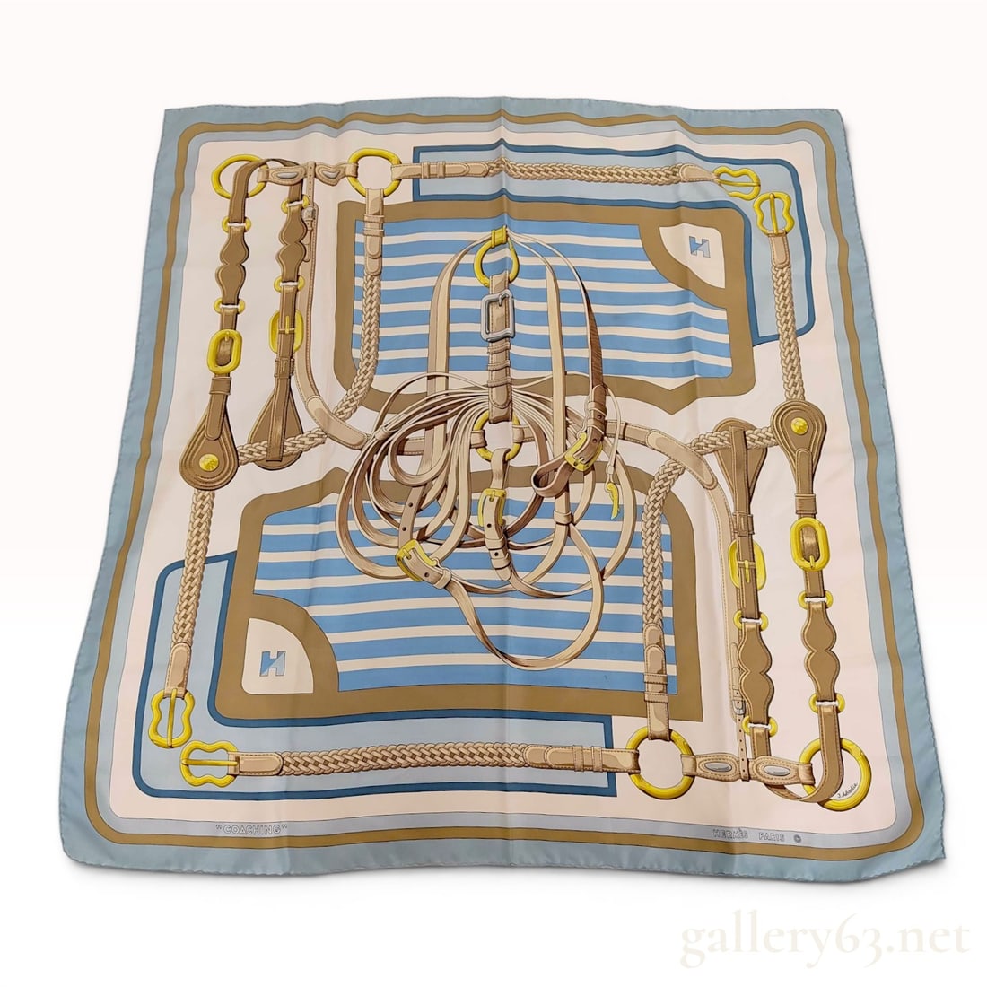 Hermes Coaching Silk Scarf by Julia Abadie: An Hermes silk square scarf, known as a carre, featuring the Coaching design by artist Julia Abadie. The equestrian-themed pattern displays an intricate arrangement of carriage harnesses, leather stra