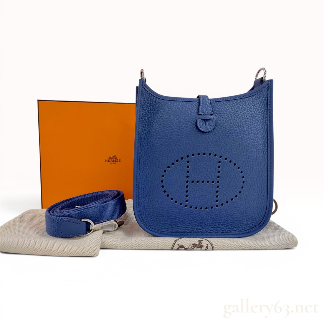 Hermes Evelyne 16 TPM Blue Taurillon Clemence Leather Crossbody Bag with Box: This bag is in excellent, near-pristine condition. Hermes Evelyne 16, also known as the TPM or Tres Petit Modele, crossbody bag crafted from blue Taurillon Clemence leather. The bag features a signatu