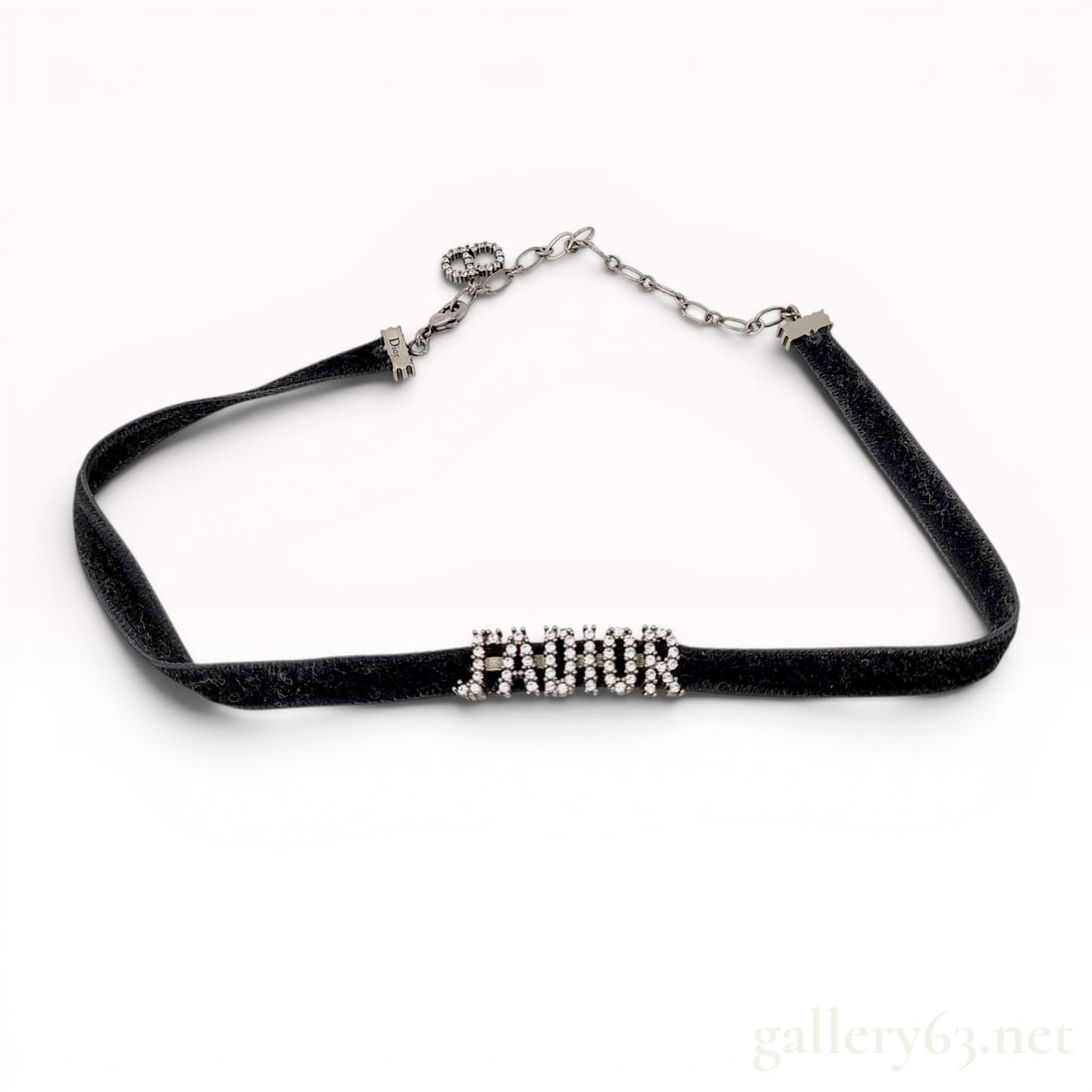 Christian Dior J'Adior Velvet and Crystal Choker: Christian Dior J'Adior choker, contemporary. Features a black velvet ribbon base centered with a silver-tone metal J'ADIOR script element pave-set with round clear crystals. Includes silver-tone metal