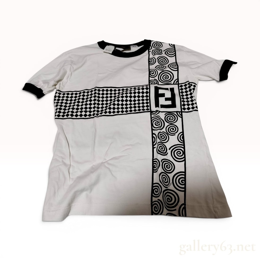 Fendi Vintage Short Sleeve Graphic Ringer T-Shirt: This vintage Fendi ringer-style T-shirt is crafted from white cotton with black rib-knit trim at the crew neck and sleeve cuffs. The front is decorated with an asymmetrical black graphic print featuri