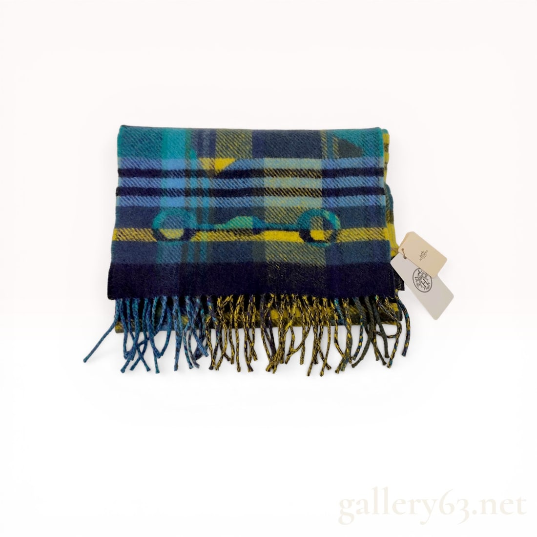 Hermes Men's Cashmere Tartan Scarf: Hermes contemporary men's scarf featuring a multicolored tartan plaid in shades of navy blue, cyan, forest green, and yellow. The 100 percent cashmere fabric is jacquard-woven with large-scale equestr