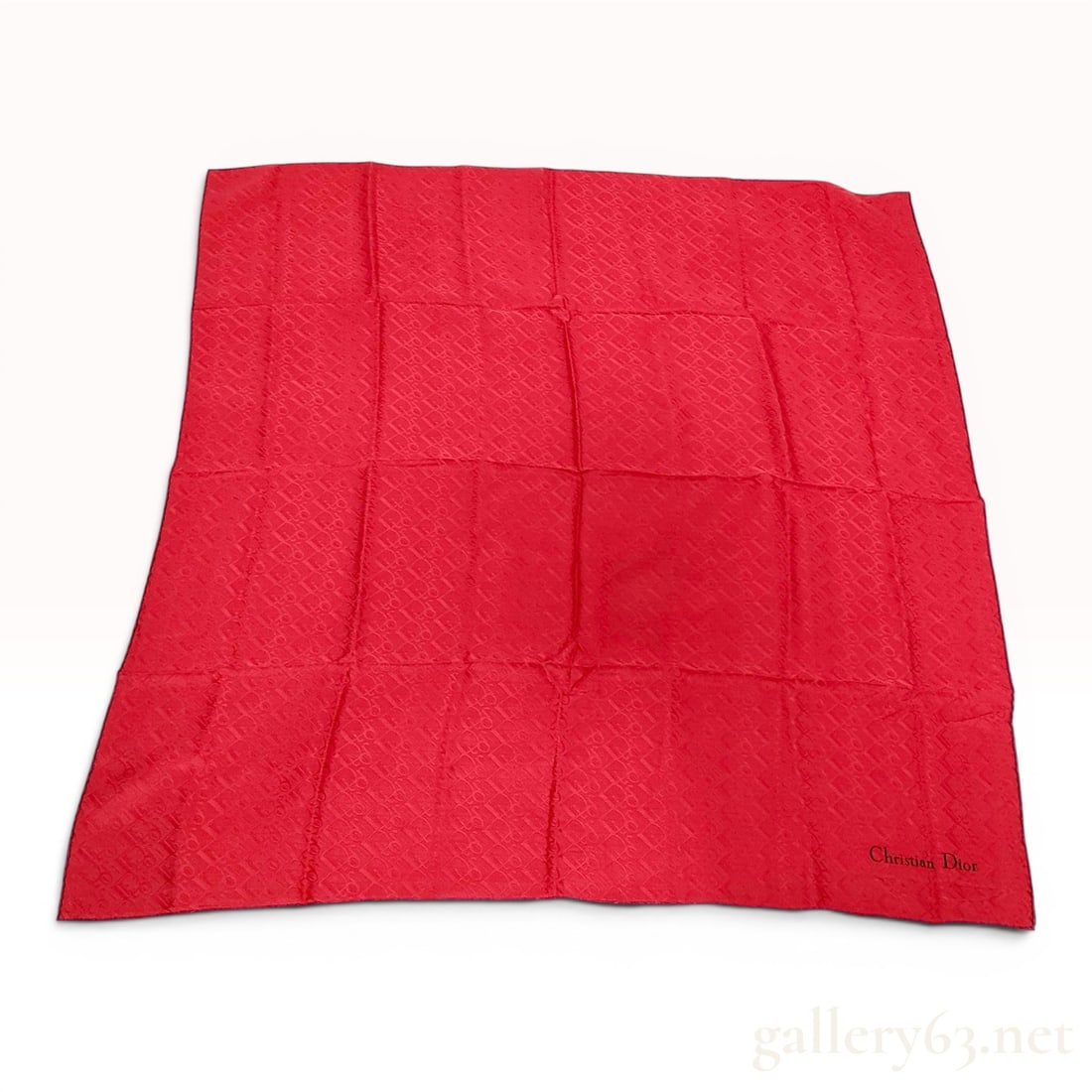 Christian Dior Red Monogram Silk Jacquard Scarf: This Christian Dior silk scarf is crafted from vibrant red silk jacquard. The body of the scarf features a repeating woven tone-on-tone monogram logo pattern. The edges are finished with a contrasting