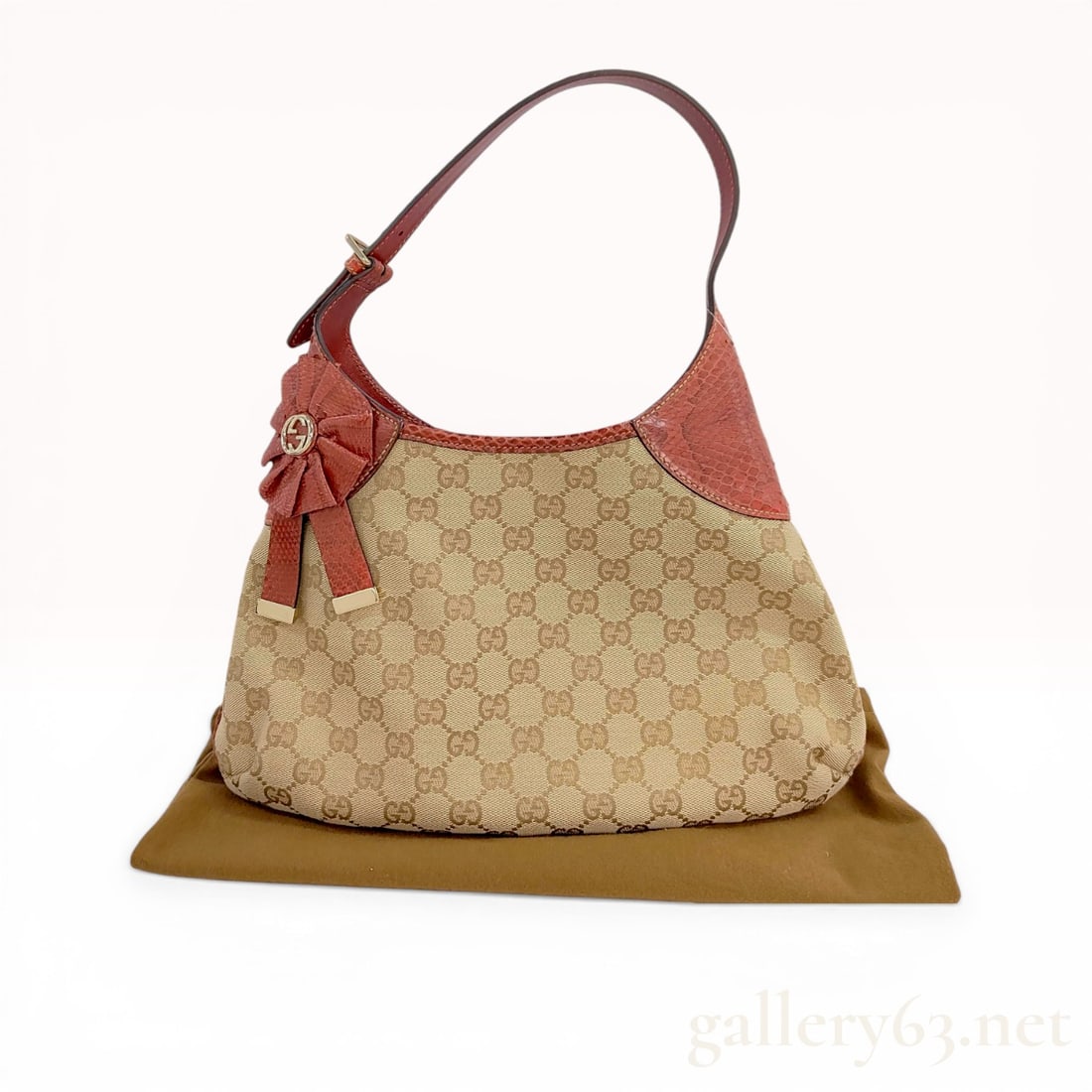Vintage Gucci GG Canvas Trophy Shoulder Bag with Python Trim: Gucci GG monogram canvas shoulder bag with red python skin trim, early 21st century. The hobo-style body features an adjustable python shoulder strap with a smooth leather underside and a decorative p