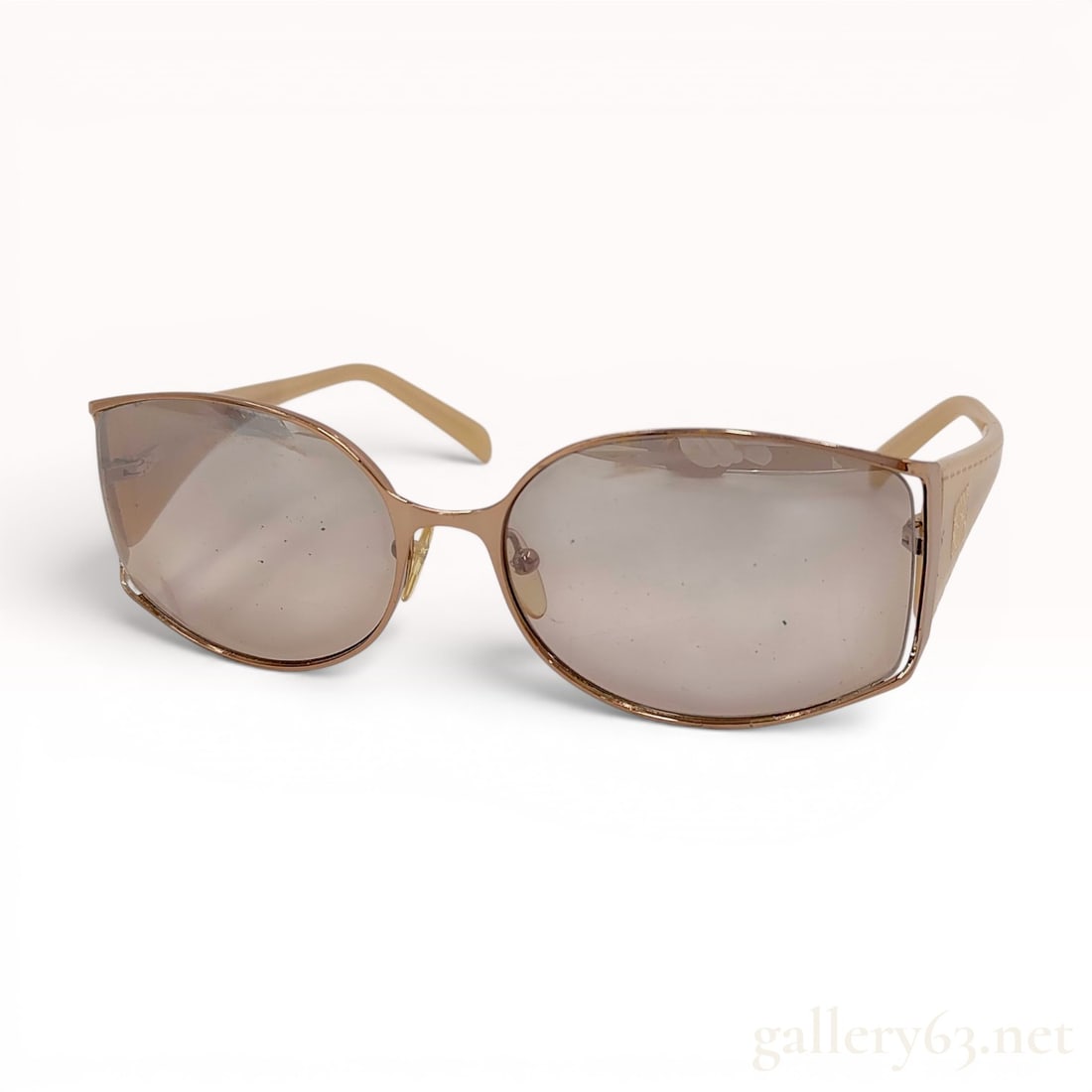 Loewe SLW 168 Women's Semi-Rimless Designer Sunglasses: A pair of Loewe SLW 168 designer women's sunglasses manufactured in Italy. The eyewear features a gold-tone metal frame construction with large, modified oval, semi-rimless lenses in a brown gradient 