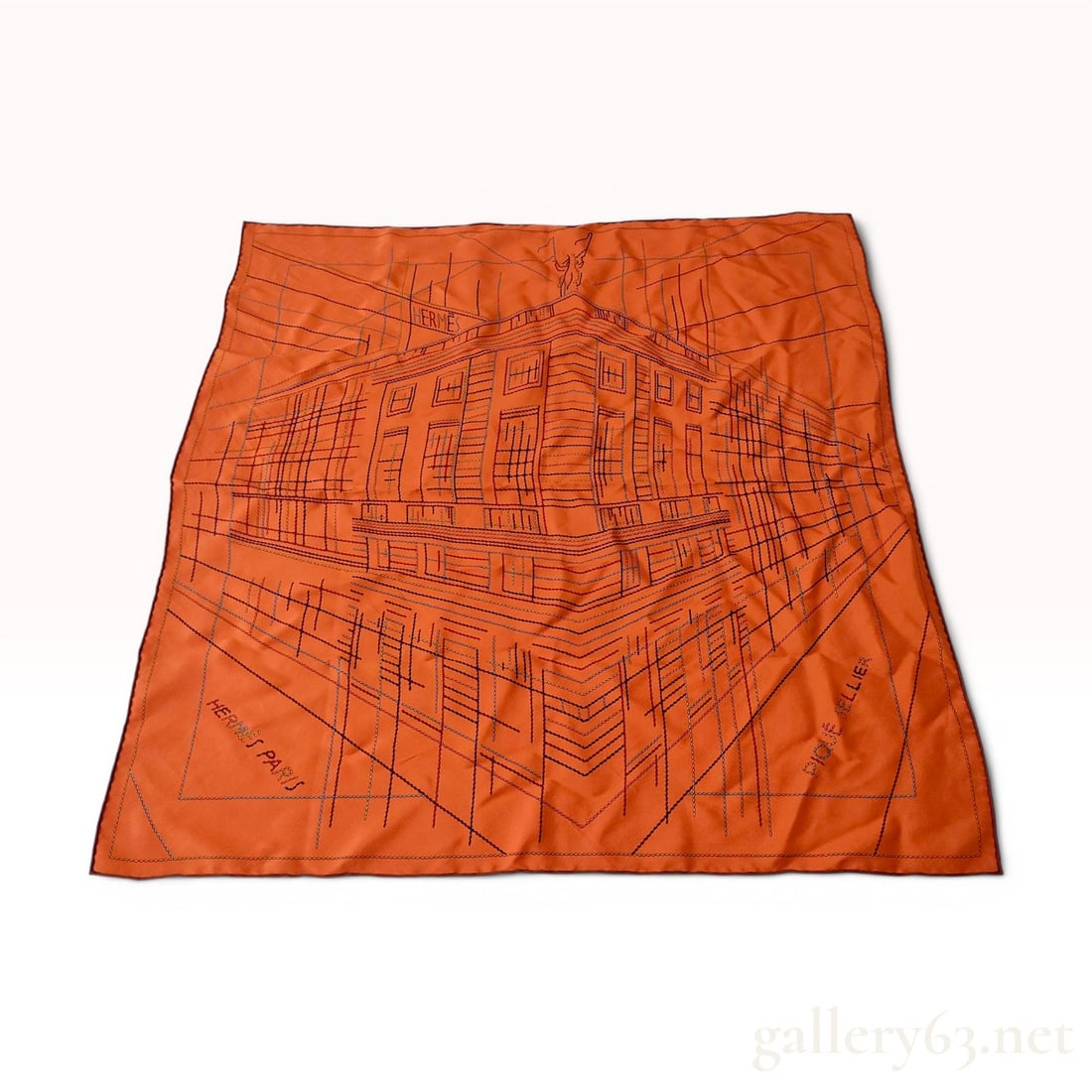 Hermes Pique Sellier Silk Scarf: This Hermes silk scarf features the Pique Sellier pattern, depicting a stylized architectural perspective of the brand flagship boutique at 24 Rue du Faubourg Saint-Honore in Paris. The design is rend