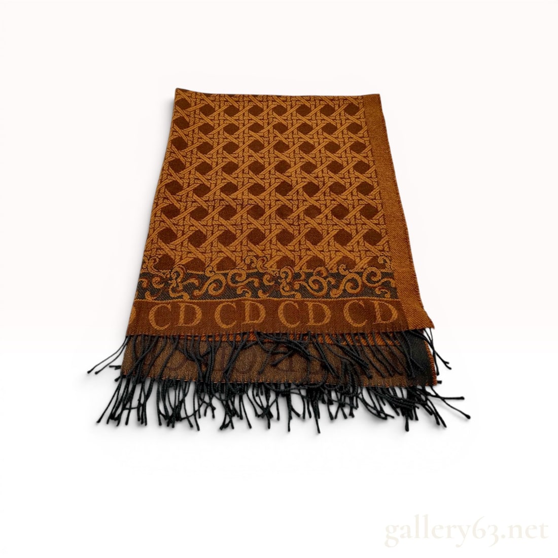 Christian Dior Cannage Motif Wool Lap Blanket: Christian Dior wool lap blanket featuring a repeating cannage motif in ochre and brown tones. The design includes a foliate scroll border with a CD logo band and a twisted dark grey fringe. It bears a