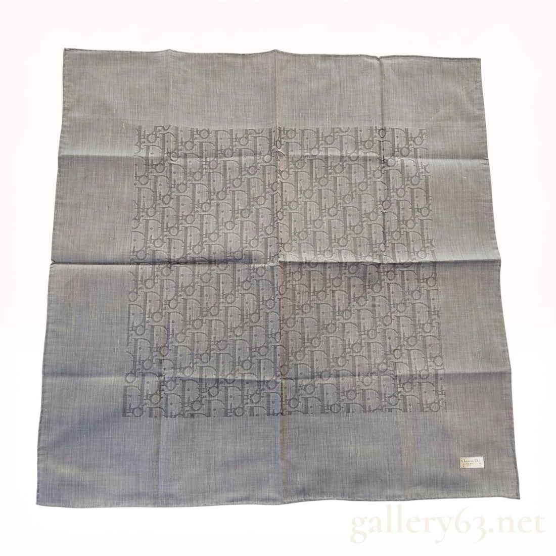 Christian Dior Oblique Monogram Cotton Pocket Square: Christian Dior cotton pocket square or neckerchief, late 20th century. The grey monochromatic textile features a central Dior Oblique monogram pattern framed by a wide solid border with machine-stitch