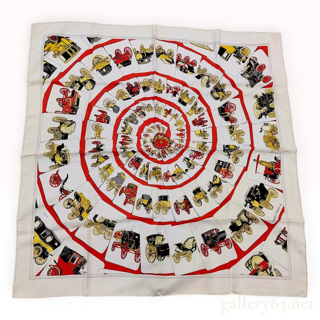 Hermes Carrosserie Silk Scarf by Philippe Ledoux: This authentic Hermes silk twill scarf, titled Carrosserie, features a design by artist Philippe Ledoux. The motif consists of a central decorative banner displaying the title, surrounded by concentri