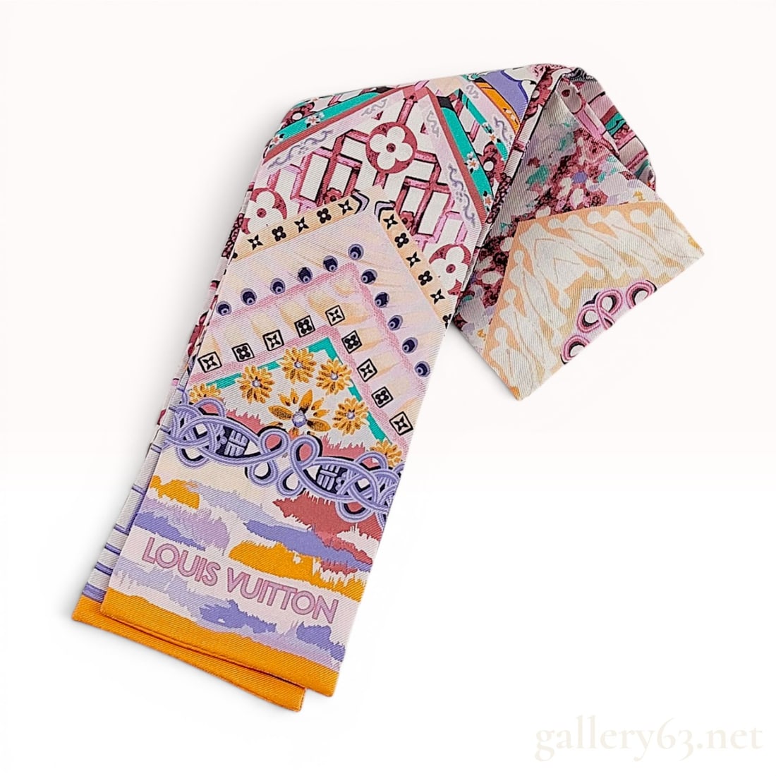 Louis Vuitton Paradise Flower Silk Bandeau Scarf: This Louis Vuitton bandeau scarf, identified as the Paradise Flower model (M00470), is constructed from 100% silk. The design features a complex, multi-colored decorative print that integrates floral 