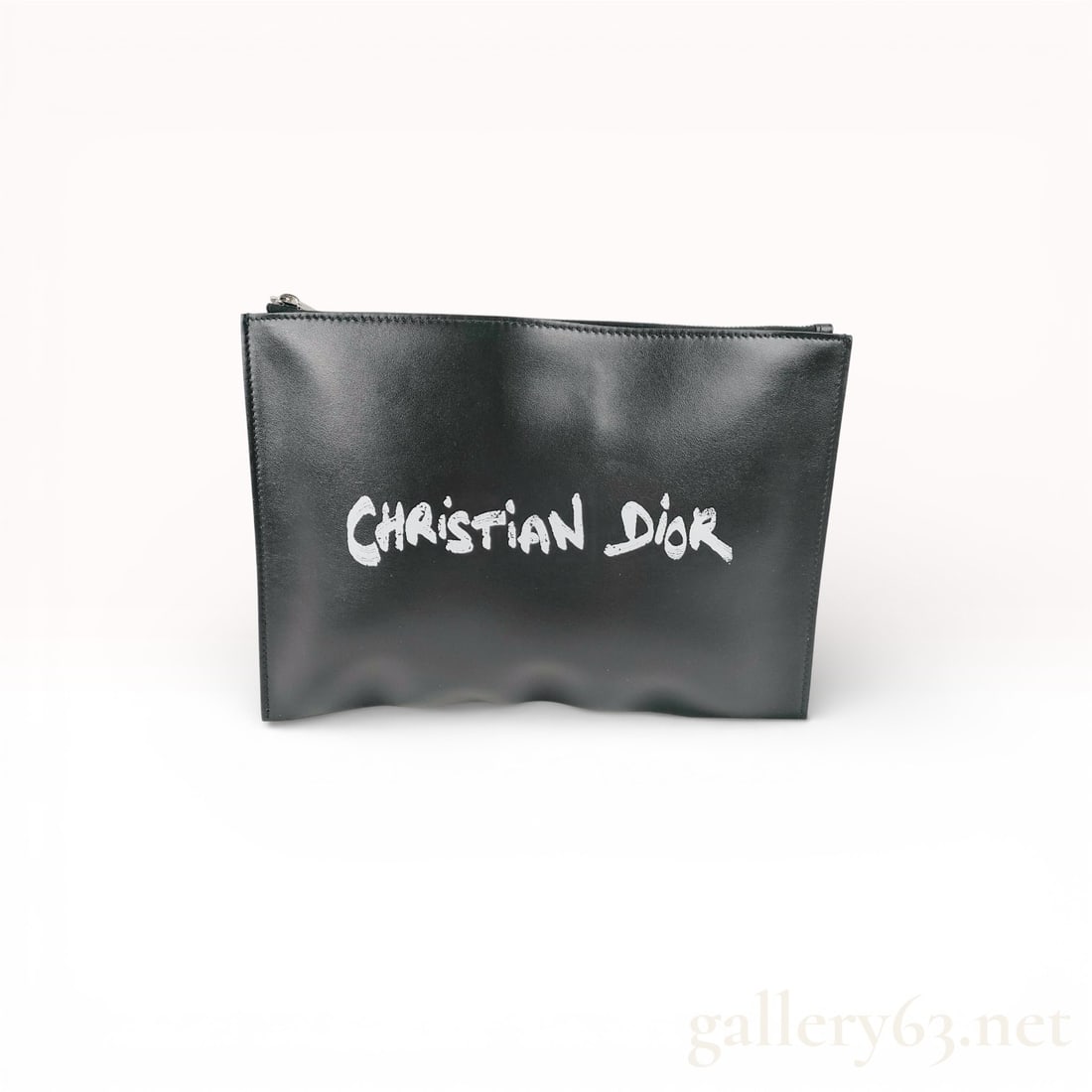 Christian Dior Daily Script Black Leather Zip Pouch: Christian Dior Daily Script zip pouch in black calfskin leather, contemporary. The exterior features a white hand-painted style graphic logo across the front and a silver-tone top zipper closure. The 