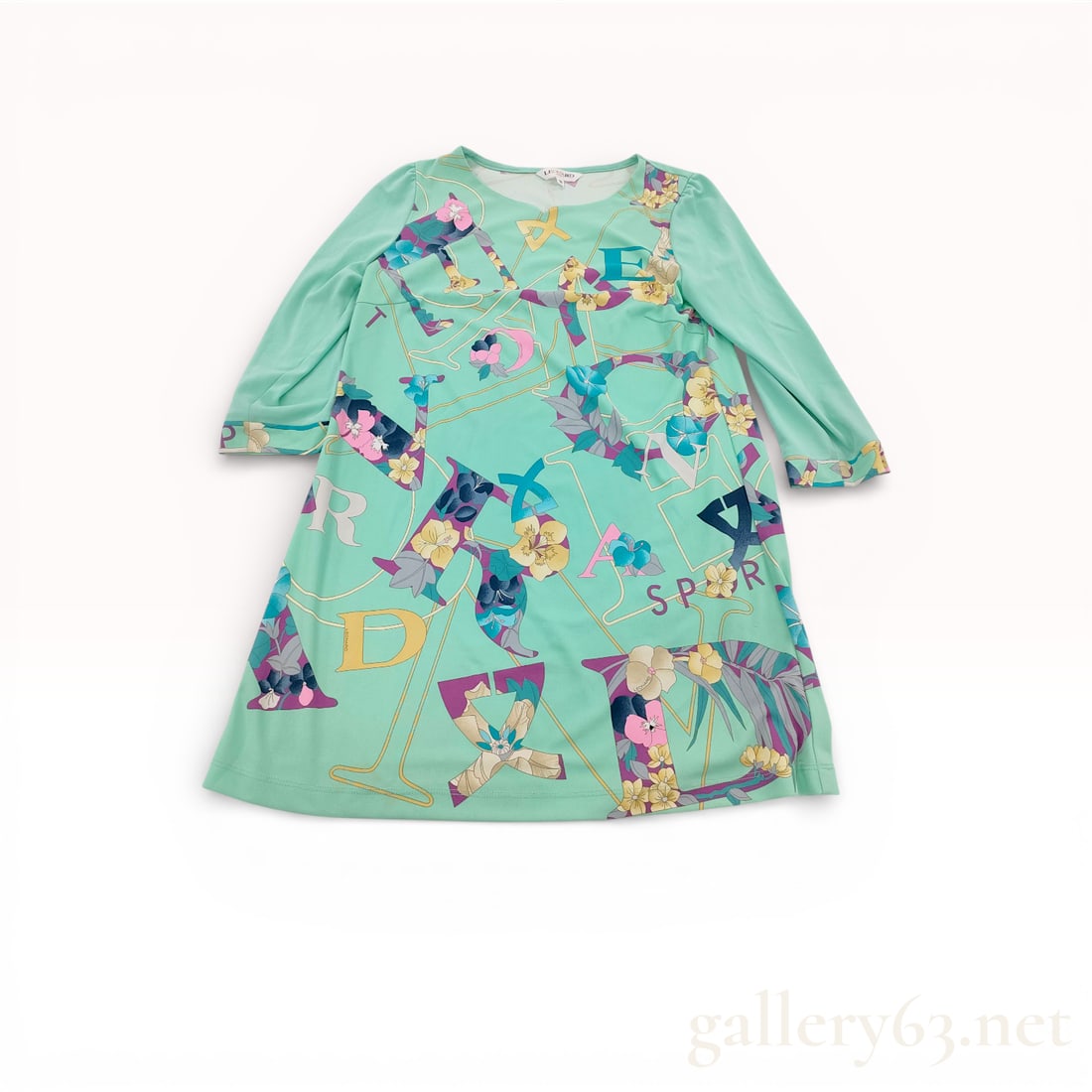 Leonard Sport Mint Green Graphic Print Long Sleeve Tunic Top Size 38: Leonard Sport tunic top featuring mint green polyester fabric with multicolor graphic and floral print throughout. A-line silhouette having a wide crew neckline and three-quarter length sleeves. Front