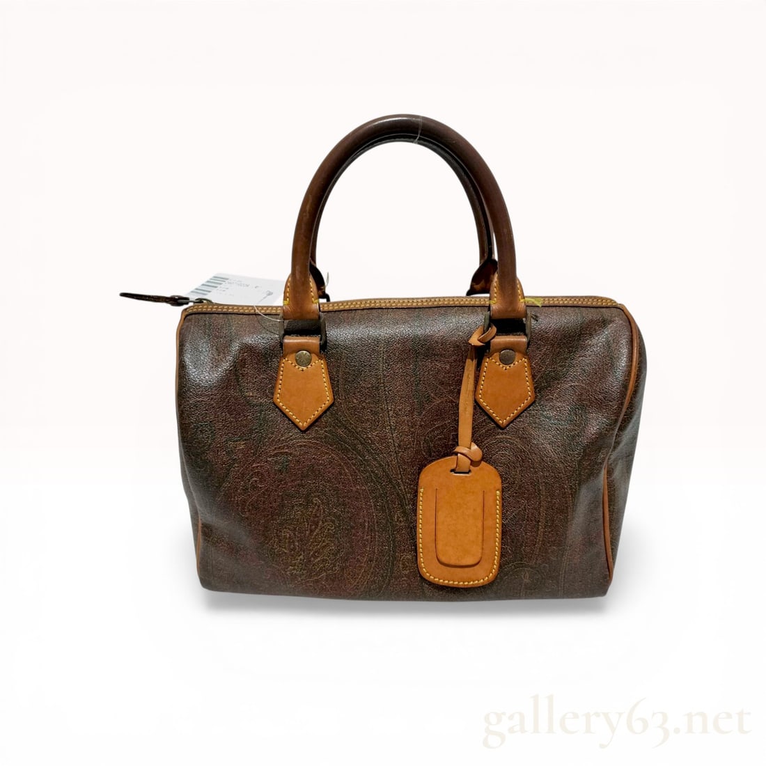 Etro Paisley Coated Canvas Boston Bag: Etro Boston bag featuring the signature multicolored paisley pattern on coated canvas with tan leather trim. The structured design includes dual rolled top handles, a full-length top zipper closure, a