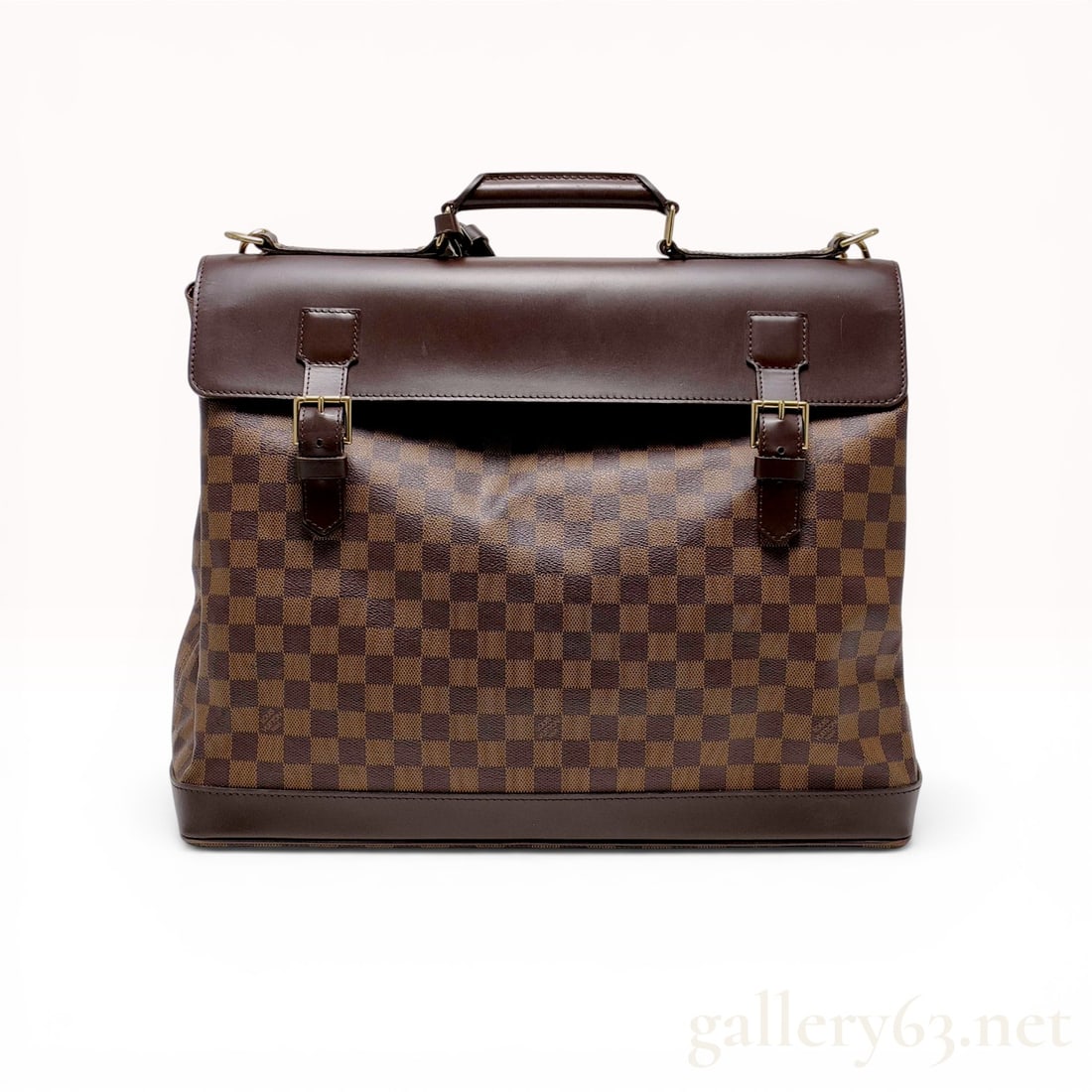 Louis Vuitton Damier Ebene West End Travel Bag: Louis Vuitton West End travel bag in Damier Ebene coated canvas with dark brown cowhide leather trim and gold-tone brass hardware. The construction features a large top flap secured by dual buckled le