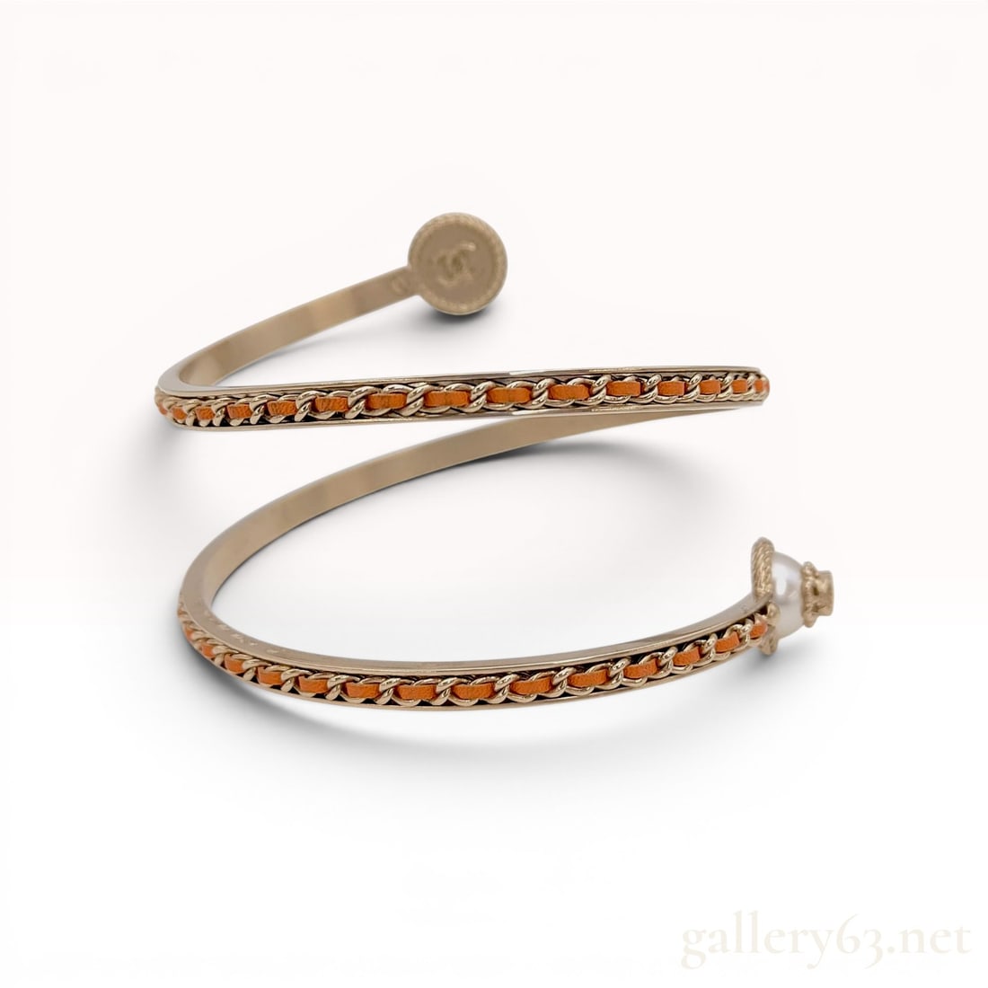 Chanel Spring 2018 B18 C Spiral Leather and Chain Wrap Bangle Bracelet with Box: Chanel gold-tone metal spiral wrap-around bangle bracelet from the Spring 2018 collection. Features a double-tiered spiral design with signature gold-tone chain and orange leather weave, one terminal 