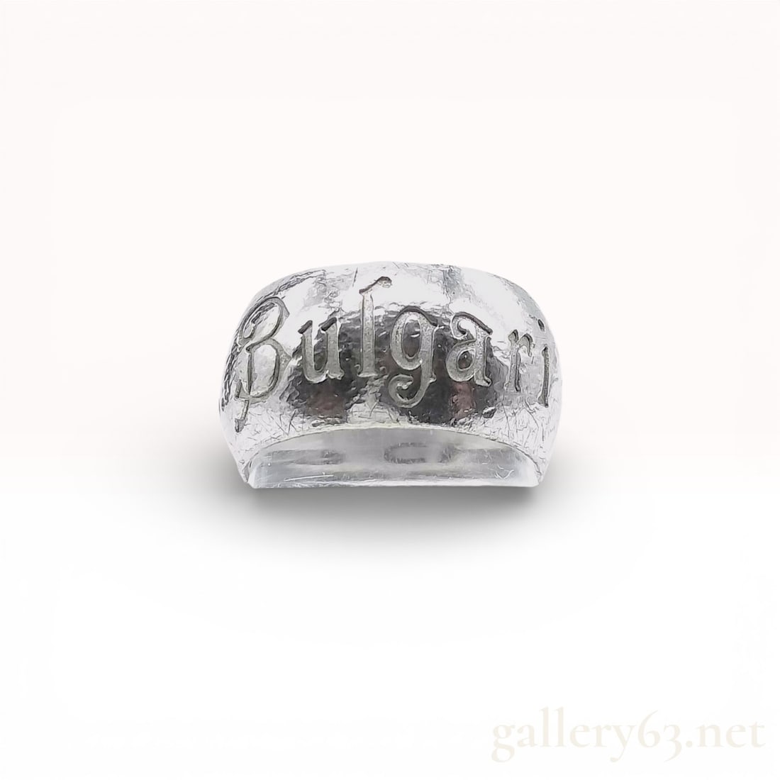 Bvlgari Save the Children Sterling Silver Ring, size 5: This Bvlgari Save the Children edition band ring is crafted from.925 sterling silver with a textured exterior finish. The outer band features the Bulgari name in stylized script alongside chased decor