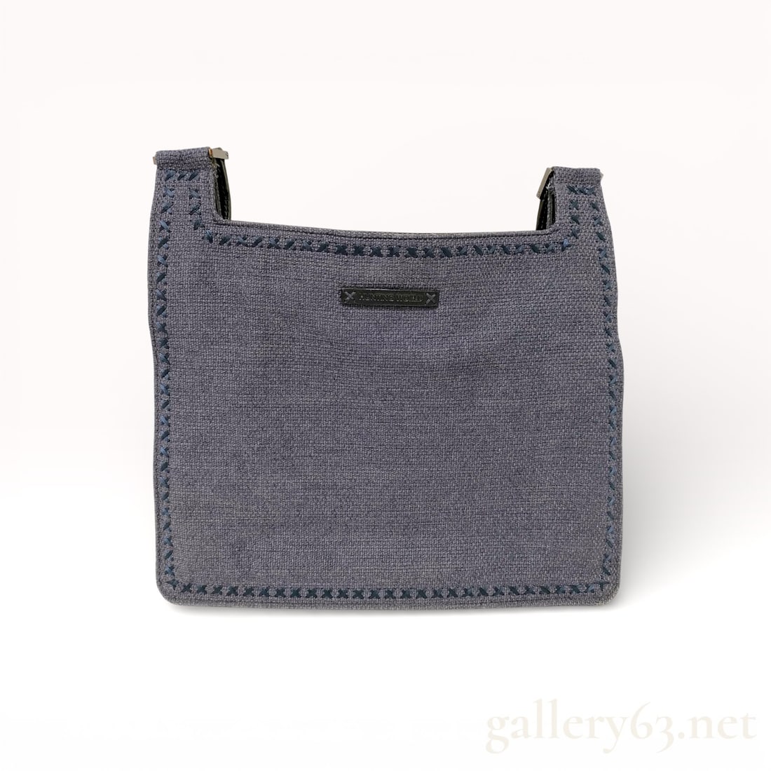 Hunting World Mixed Media Textile and Leather Crossbody Bag: Hunting World flat crossbody bag, made in Italy. The design features a blue-grey woven textile front panel with decorative navy cross-stitching and a smooth black leather reverse, base, and adjustable