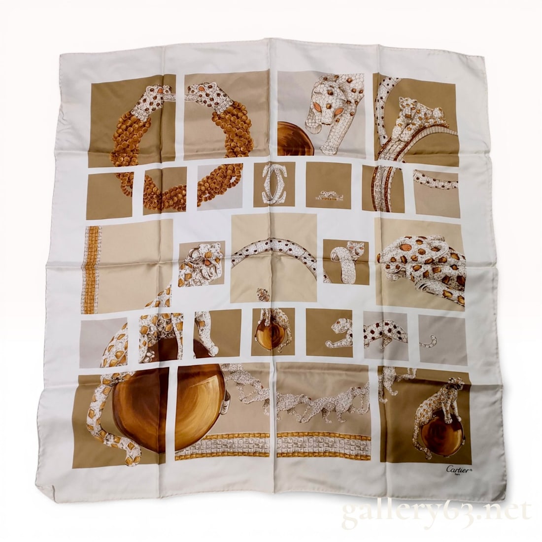 Cartier Panthere de Cartier Motif Silk Twill Scarf: Cartier silk twill scarf featuring a collage of the iconic Panthere de Cartier jewelry collection. The design consists of a grid of rectangular frames depicting various panther-themed bracelets, rings