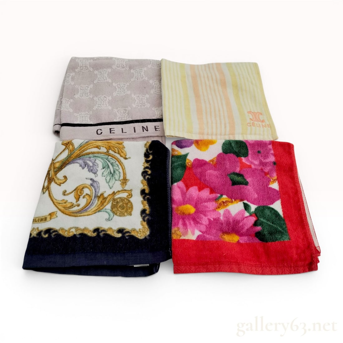 A Set of Four Celine Designer Hand Towels: This set includes four small designer hand towels or washcloths from Celine. The assortment features varied patterns including a lavender towel with an all-over woven Triomphe logo motif, a yellow and