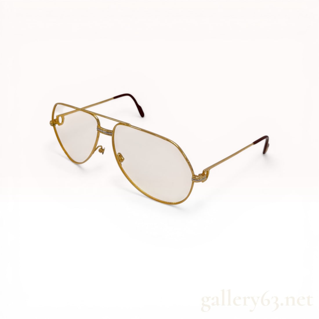 C. 1980s Vintage Cartier Vendome Louis Aviator Eyeglasses: Cartier Vendome Louis aviator-style eyeglasses, circa 1980s. Gold-toned metal frames featuring a double bridge with three-tone Trinity metalwork, signature C logo hinges, and burgundy acetate temple t