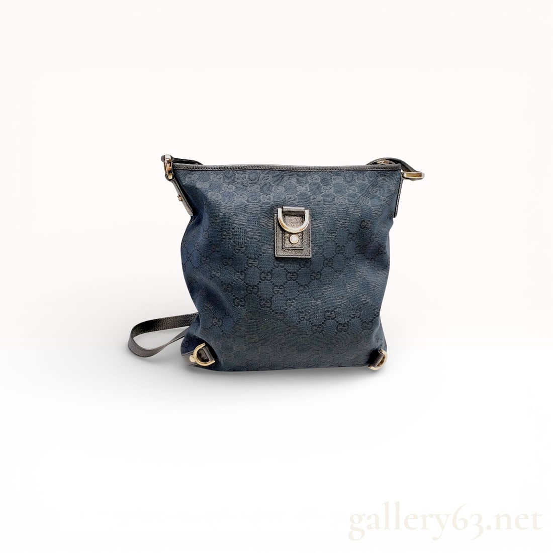Gucci Abbey D-Ring Messenger Bag in GG Canvas: Gucci Abbey D-Ring messenger bag, circa mid-2000s. Navy blue and black GG monogram canvas with black grained leather trim, gold-tone hardware, and an adjustable leather shoulder strap. Features a deco