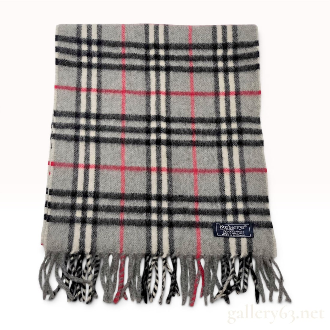 Vintage Burberrys Gray Nova Check Cashmere Scarf: A vintage Burberrys of London scarf featuring the signature Nova Check pattern on a gray ground with black, white, and red stripes. The scarf is constructed from 100% cashmere and was manufactured in 