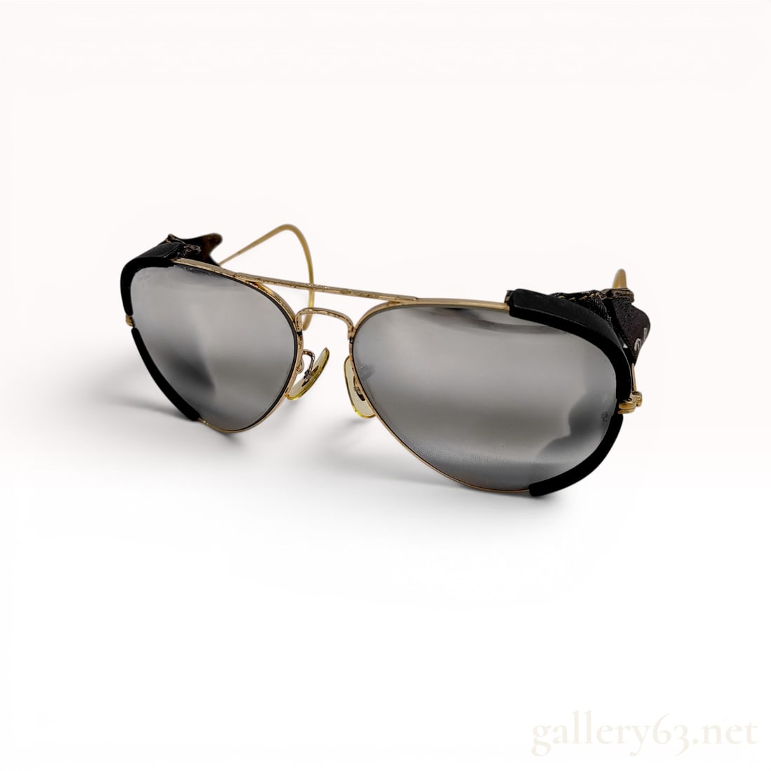 Vintage Ray-Ban Bausch & Lomb Gold-Toned Aviator Sunglasses with Leather Side Shields: Vintage Ray-Ban aviator sunglasses manufactured by Bausch & Lomb, mid to late 20th century. The gold-toned metal frame features a double bridge with a reinforced brow bar, wrap-around cable temples, a
