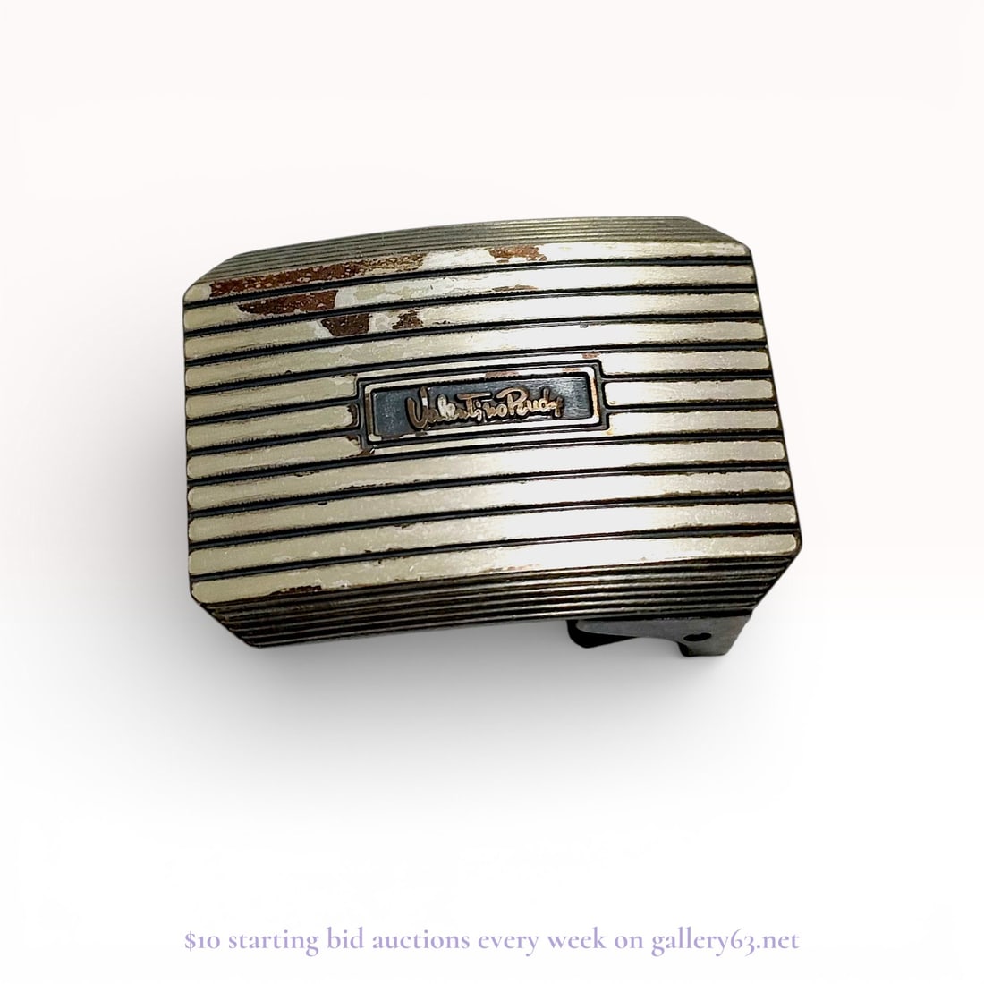 Valentino Rudy Ribbed Sterling Silver Belt Buckle: Valentino Rudy plaque-style belt buckle featuring a horizontal ribbed design. The rectangular face includes a central recessed plaque with the brand name in script lettering. Construction includes a f