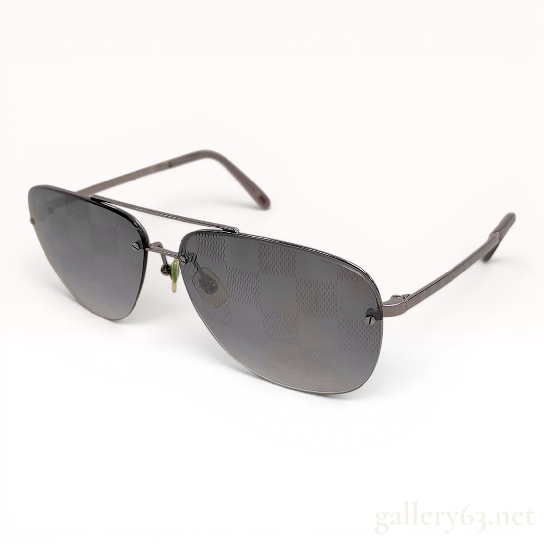 Louis Vuitton Conspiration Pilote Aviator Sunglasses Z0216U: Louis Vuitton Conspiration Pilote aviator-style sunglasses, model Z0216U. The frames are constructed from gunmetal-tone metal with a classic double bridge and adjustable nose pads. The gray gradient l
