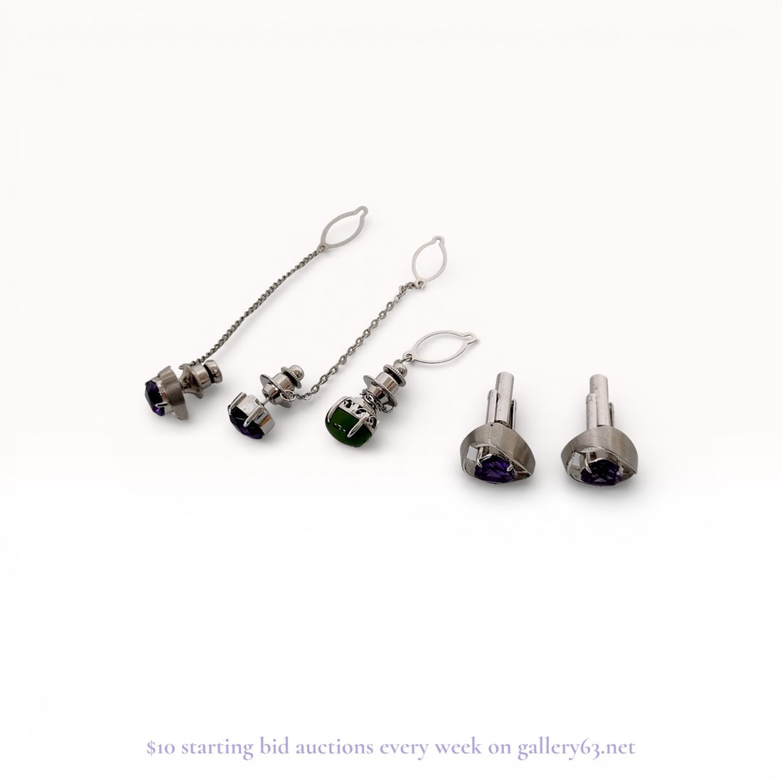 An Assortment of Men's 900 Silver and Amethyst Jewelry: An assortment of men's jewelry including a pair of modernist cufflinks and several tie tacks featuring purple and green gemstones. The 900 silver cufflinks and matching tie tack feature trillion-cut p