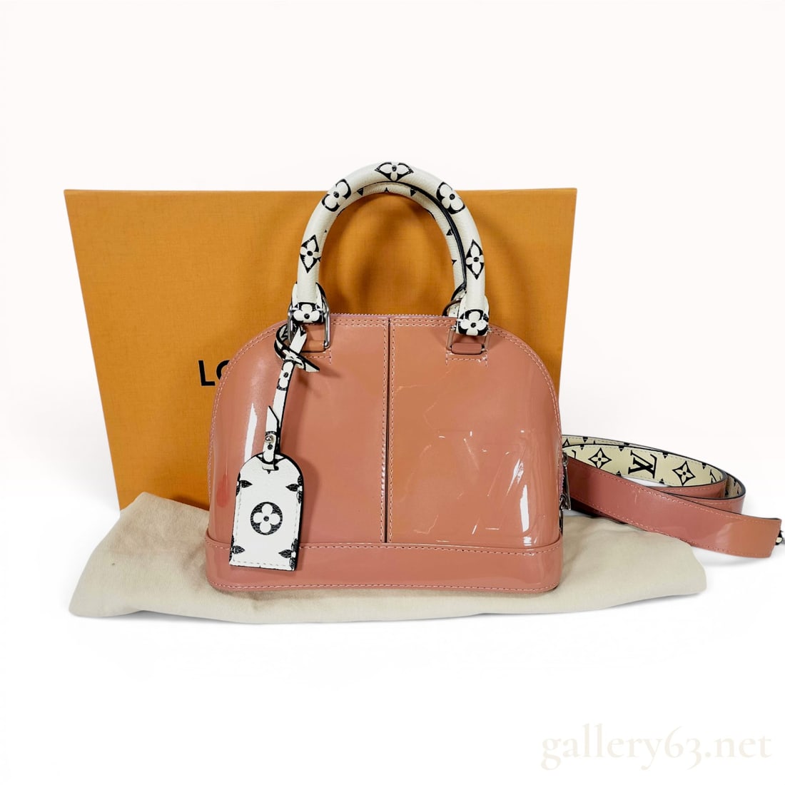Louis Vuitton Monogram Vernis Alma BB Handbag with Box: This Louis Vuitton Alma BB handbag is crafted from coral-pink Monogram Vernis patent leather with a structured, dome-shaped silhouette. It features contrasting white and black monogram patterned coate