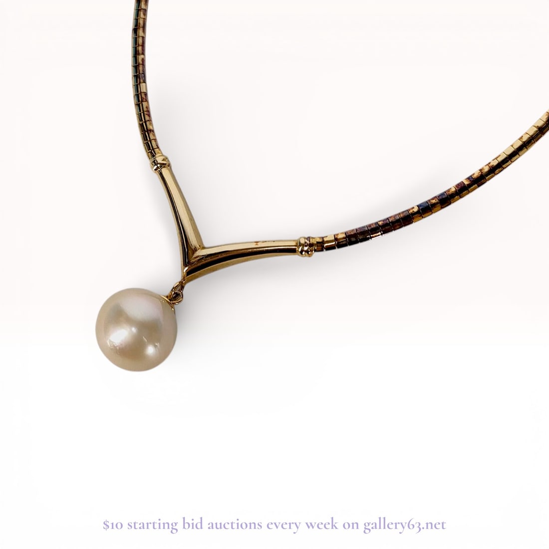 Gilt Sterling Silver Omega Chain Pearl Drop Necklace: This professional collar-style necklace is crafted from gold-plated sterling silver, commonly referred to as vermeil. The piece features a semi-rigid Omega-style chain constructed of interlocking rect