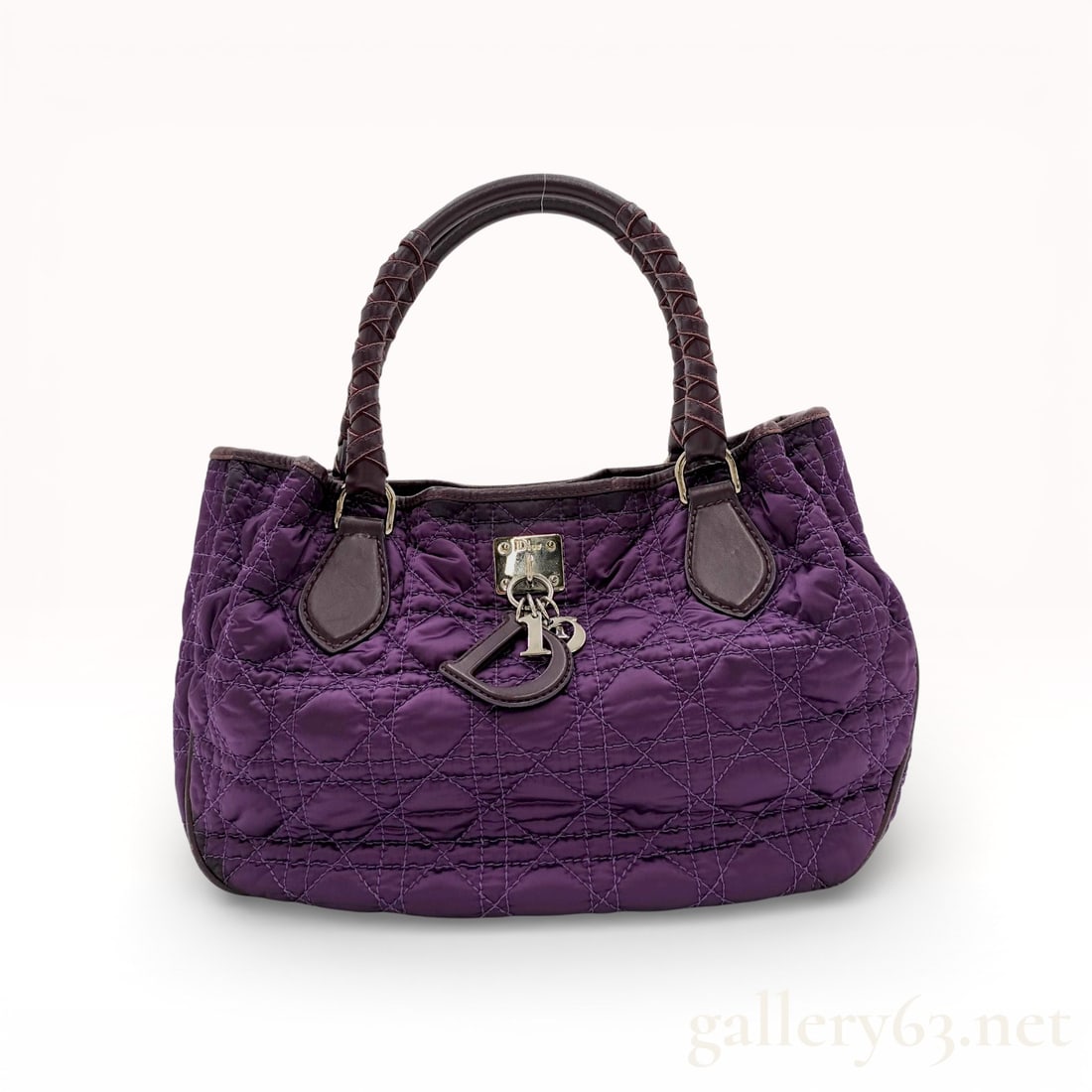Christian Dior Lady Dior Cannage Quilted Nylon Soft Tote: Christian Dior Lady Dior Cannage soft tote bag in purple quilted nylon. The exterior features leather trim, braided leather handles, silver-tone hardware, and signature D. I. O. R. metal charms. The i