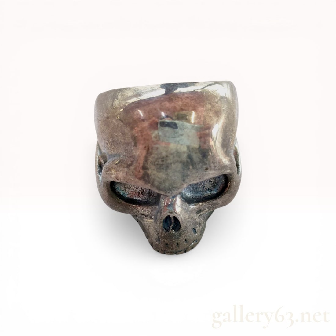 Large Sculptural Silver Skull Ring: Unbranded sculptural statement ring featuring a detailed human skull motif, likely late 20th to early 21st century. The piece is cast in silver with deep orbital sockets, a nasal cavity, and an integr