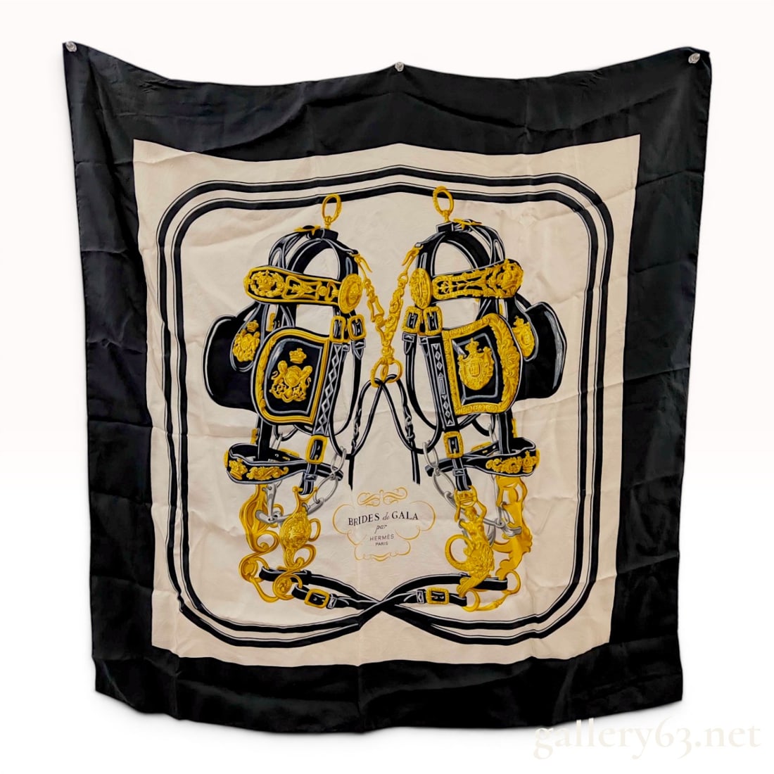 Hermes Brides de Gala Silk Twill Scarf 90: Hermes Carre 90 silk twill scarf featuring the Brides de Gala pattern originally designed by Hugo Grygkar. The equestrian design displays two ornate ceremonial horse bridles in gold, silver, and black