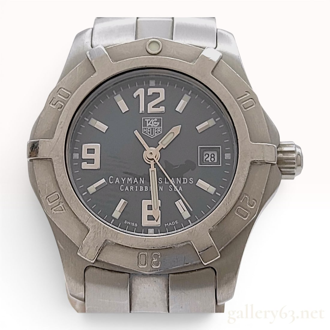 TAG Heuer 2000 Exclusive Cayman Islands Caribbean Sea Limited Edition WN131M Stainless Steel Quartz: This TAG Heuer 2000 Exclusive Cayman Islands Caribbean Sea Limited Edition wristwatch, reference WN131M. BA0333, features a stainless steel construction with a quartz movement. The teal-blue dial is d