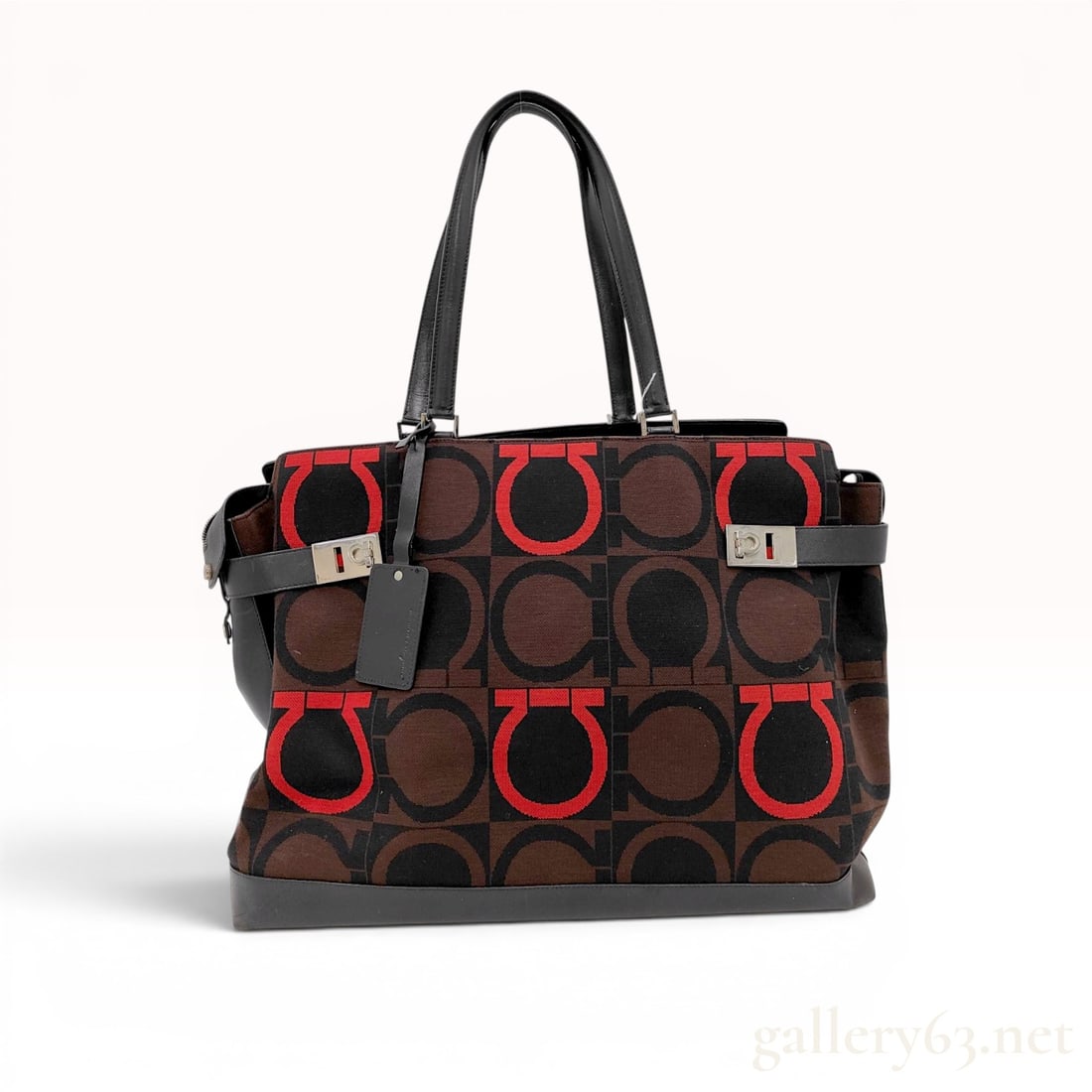 Salvatore Ferragamo Large Gancini Logo Jacquard and Leather Tote Bag: Salvatore Ferragamo large tote bag, model AU-24 0700, made in Italy. The bag features a tri-color brown, black, and red jacquard canvas body with an oversized Gancini monogram pattern, trimmed with sm