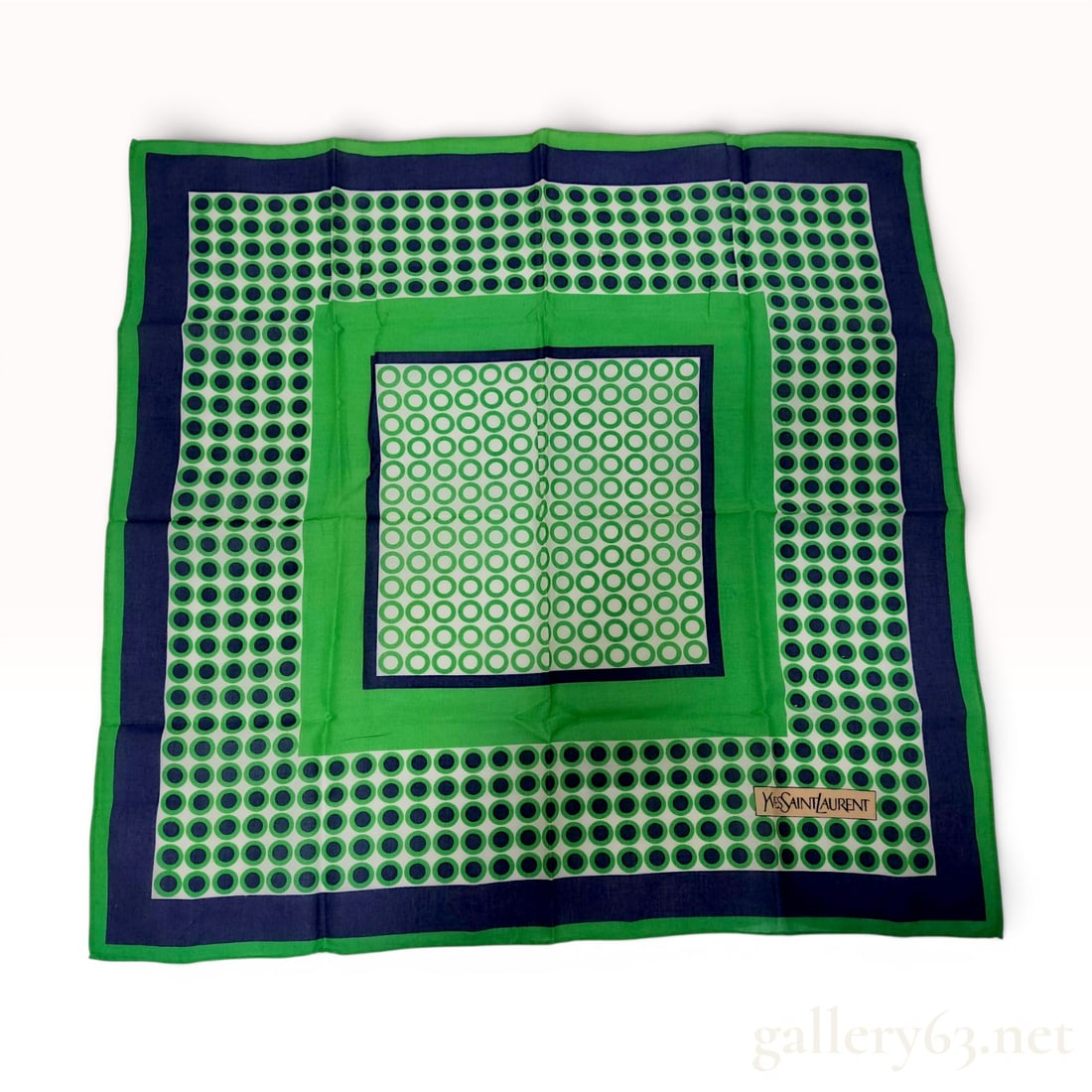 Yves Saint Laurent Geometric Concentric Square Silk Scarf: Square scarf by Yves Saint Laurent featuring a multi-layered geometric design. The composition consists of concentric square borders starting with an outer green edge, followed by a broad navy blue ba