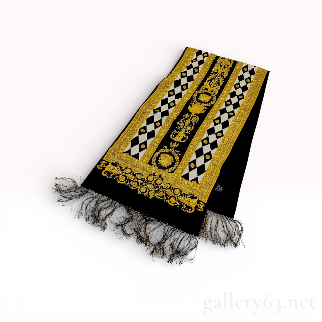 Atelier Versace Baroque Medusa Silk and Wool Fringed Stole: This Atelier Versace rectangular stole features a signature ornate Baroque-inspired print. The design incorporates the house's iconic Medusa head motifs, neo-classical urns, and scrolling acanthus lea